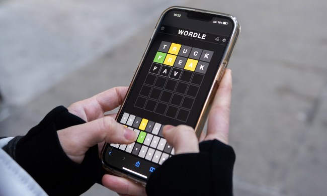 A person plays 'Wordle' on an iPhone.