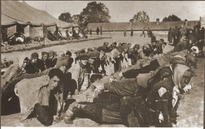 Soviet prisoners of war are forced to exercise while imprisoned in a camp.