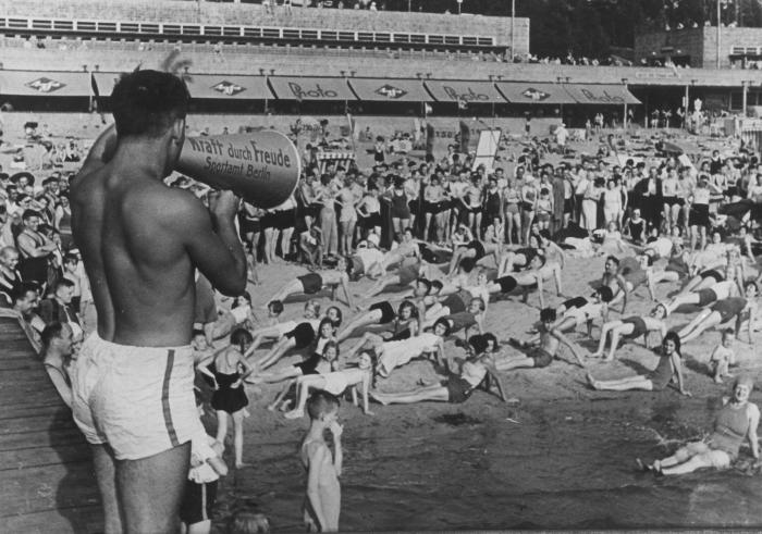 The featured photograph shows a “Strength through Joy” event held on the outskirts of Berlin on April 24, 1937.