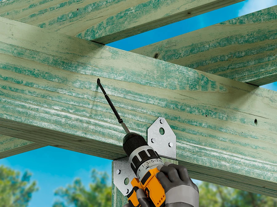 Strong-Drive® SWD double-threaded screw fastening a beam to post on an outdoor structure.