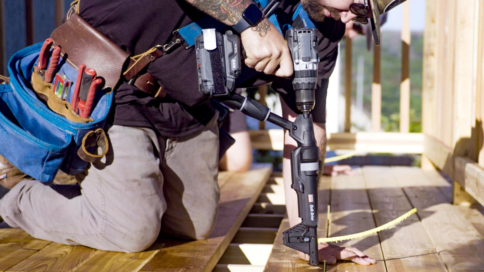 Man using ProjectPro to drill collated screws into subfloor.